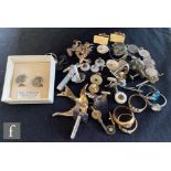 A small parcel lot of jewellery to include three 18ct rings, total weight 6.3g, a silver tie slide