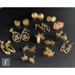 Fourteen pairs of 9ct stud earrings of various styles, total weight 13g. (14)