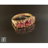 A 9ct hallmarked Edwardian style graduated five stone almandine garnet ring, claw set stones to a