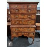A 19th century George I style figured walnut chest on stand, the upper section fitted with two short