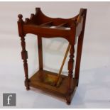 A Victorian light oak umbrella stand, shaped back and turned supports, height 92cm x depth 34cm x