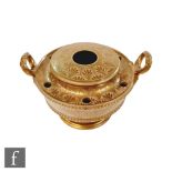 A 19th Century inkwell with six quill holes and a central reservoir, the buff coloured body with a