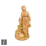 A late 19th Century Royal Worcester figure of a lady water carrier holding a jug and standing by a