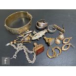 A small parcel lot of assorted jewellery to include gold brooches, metal fobs, silver earrings and a