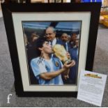 A signed photograph of Diego Maradona with certificate of authenticity, framed and glazed, image