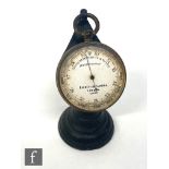 A Negretti & Zambra compensated pocket barometer No 13450 with associated stand.