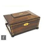 A 19th Century William IV brass inlaid rosewood sewing box of sargophical form, fitted with a