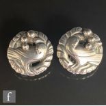 A pair of Danish silver clip earrings modelled as a dove within a floral border, diameter 24mm,