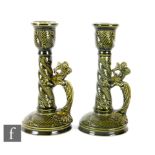 Wardle - A pair of late 19th Century candlesticks in the Aesthetic style, each with a dragon