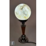Unknown - A 1930s Art Deco table lamp, the chromed stepped circular base extending to an amber