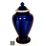 Ruskin Pottery - A large vase and cover decorated in an all over dark blue souffle glaze with
