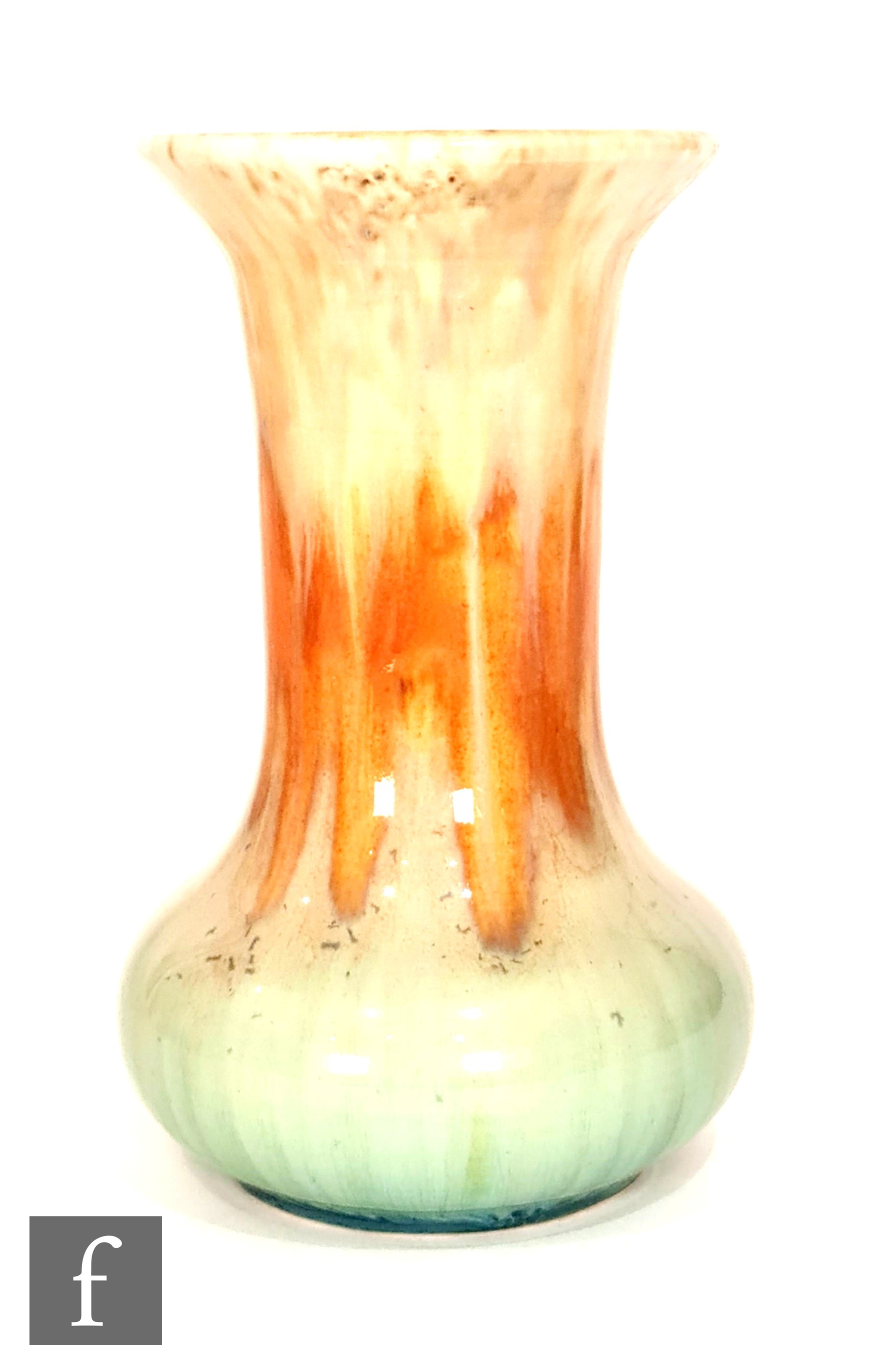 Ruskin Pottery - A vase of globe and shaft form decorated with a streaked ochre to orange to pale