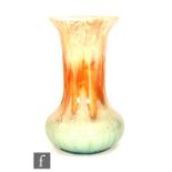 Ruskin Pottery - A vase of globe and shaft form decorated with a streaked ochre to orange to pale