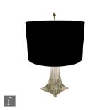 St Louis - A glass table lamp on a spreading square form base rising to a tapered clear glass