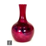 Bernard Moore - A small early 20th Century flambe glaze vase of globe and shaft form decorated in an