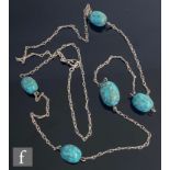 Unknown - An early 20th Century silver necklet highlighted with five oval turquoise coloured