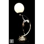 Unknown - A 1930s Art Deco table lamp, the curved frame with a silhouette of a lady holding off