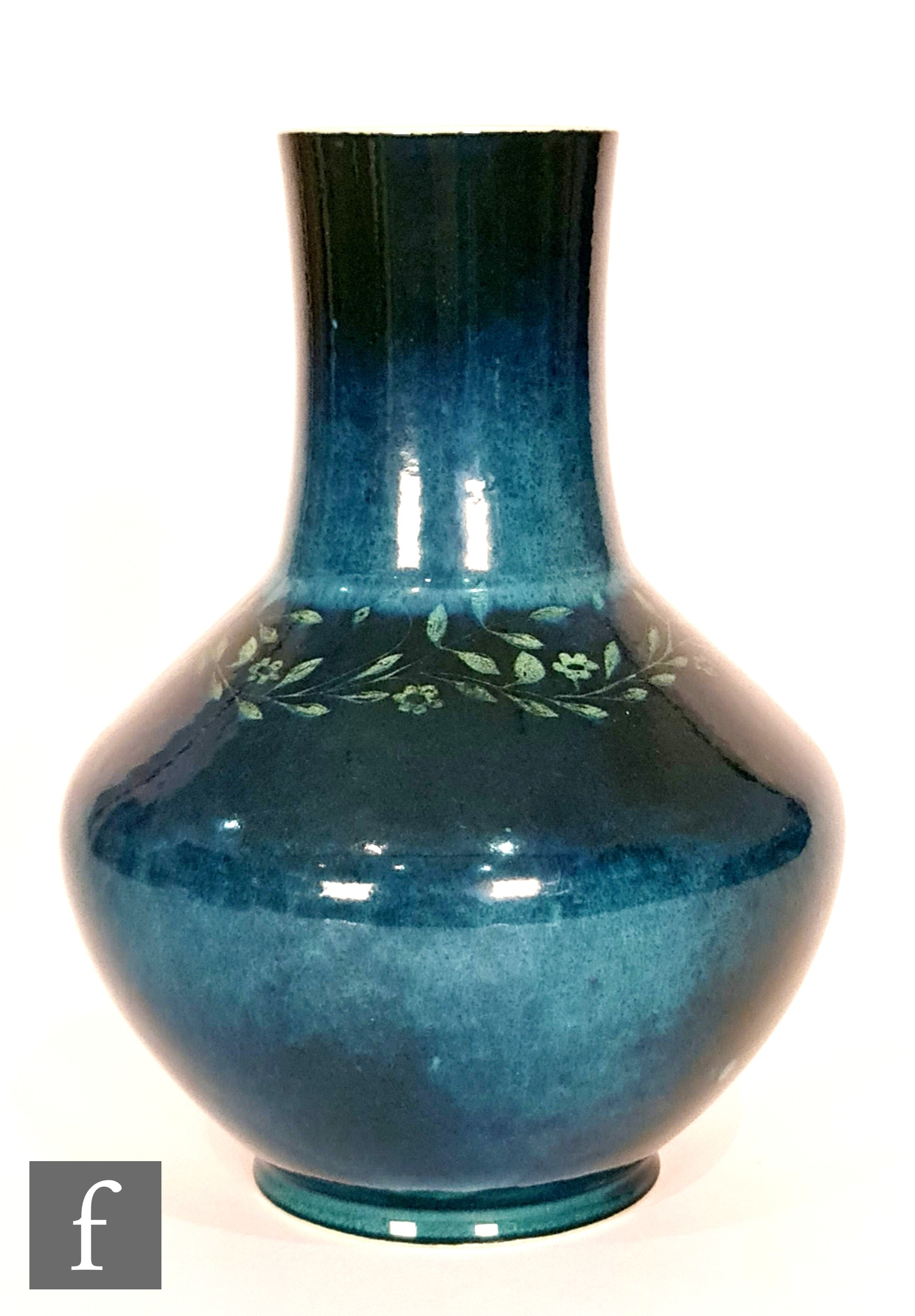 Ruskin Pottery - A souffle glazed vase of angular form with a cylinder neck decorated in a mottled