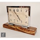 Unknown - A 1930s 8-day mantle clock, the variegated ochre marble base supporting a chromed square