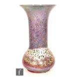 Ruskin Pottery - A high fired vase of globe and flared shaft form decorated in a tonal lavender