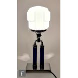 Unknown - An Art Deco chrome and glass table lamp, a geometric tinted blue opaque glass shade,