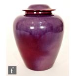 Ashby Potters Guild - An early 20th Century Arts and Crafts vase and cover, the tapering body