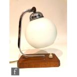Unknown - A 1930s Art Deco table lamp, the wooden canted base with chromed arch stem and opaline