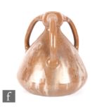 Ashby Potters Guild - An early 20th Century Arts and Crafts tri-handled vase, the body of conical