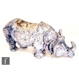 Joan Elizabeth Woollard - A hand built sculpture of a rhinoceros glazed in blue, signed J.E Woollard