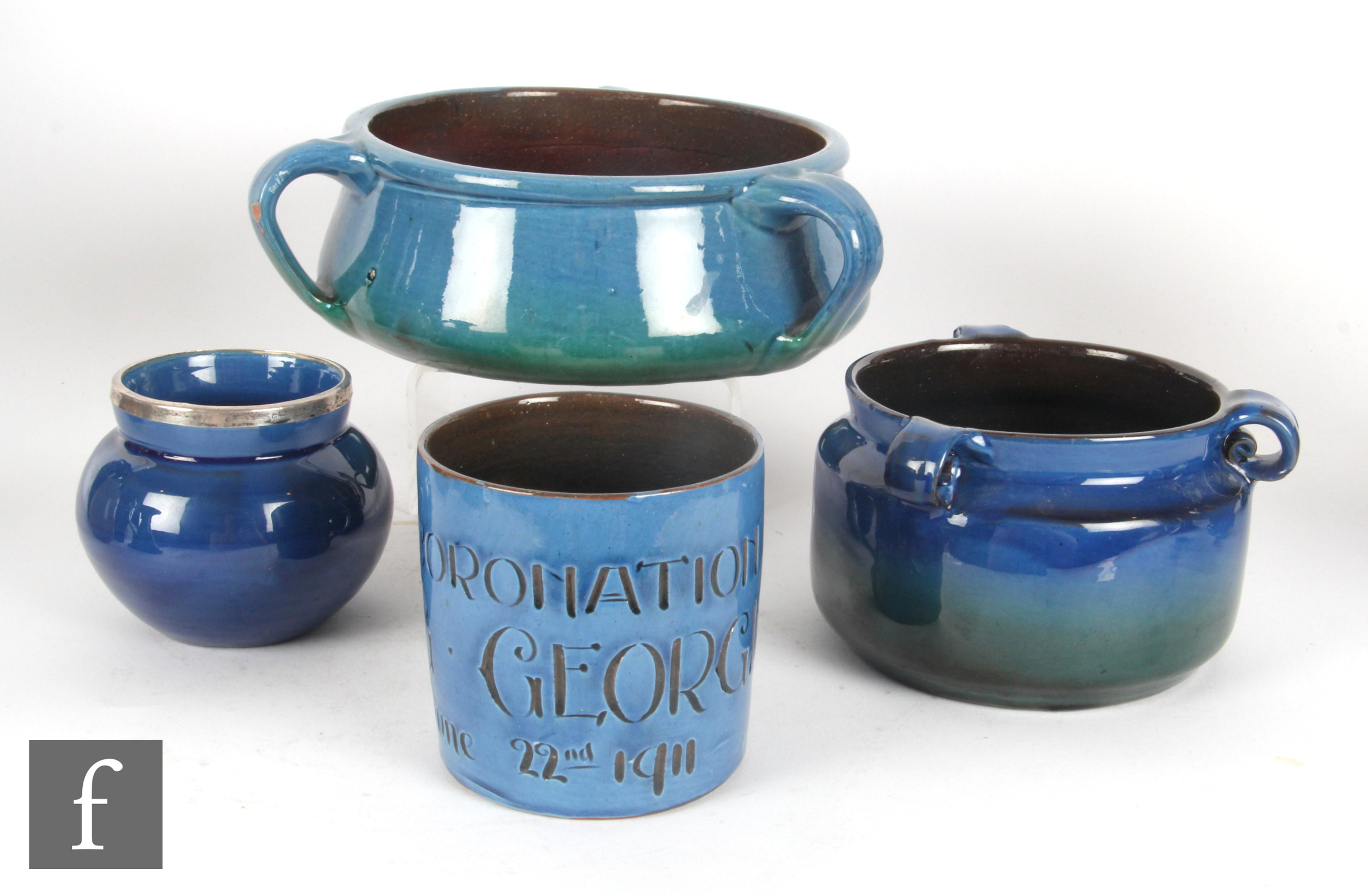 C.H Brannam - Four pieces of early 20th Century Arts and Crafts comprising a mug incised