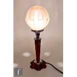 Unknown - A 1930s Art Deco table lamp, the scalloped amber coloured base and stem with black swirl