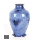 Ashby Potters Guild - An early 20th Century Arts and Crafts footed baluster vase decorated in a