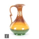 In the manner of Christopher Dresser - Watcombe - A late 19th Century Aesthetic jug decorated in