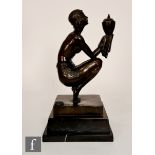 After Demétre Chiparus - A later 20th Century bronze figure, the stepped black marble base extending