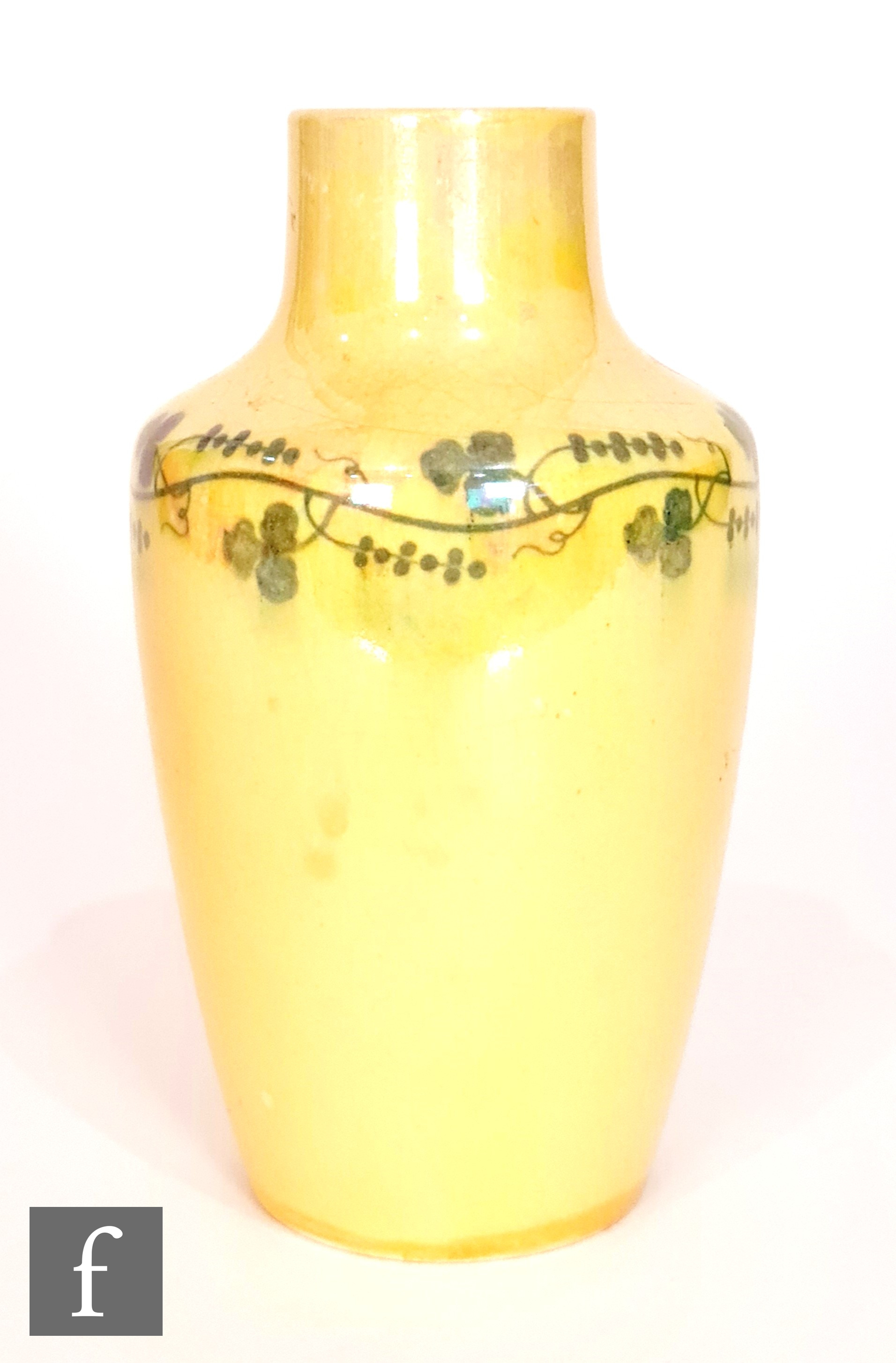Ruskin Pottery - A small vase decorated in an all over yellow lustre with a painted garland to the