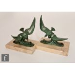 Unknown - A pair of 1930s patinated green spelter figures of seagulls in flight above crashing