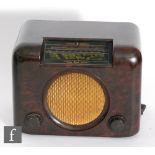 A Bush DAC90A brown Bakelite cased radio, width 30cm.