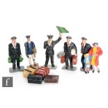 A collection of Timpo hollowcast railway staff figures, ti include a porter with trolley and luggage