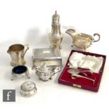 A small parcel lot of hallmarked silver items to include a sauce boat, an Art Deco cream jug, a