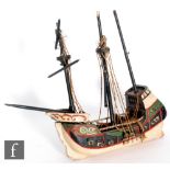 A 1930s or later painted wooden model of a fourteen gun swivel galleon, length 33cm, A/F.