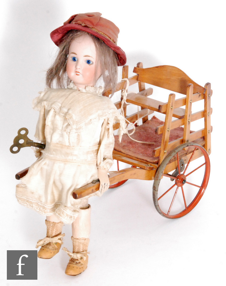 A late 19th Century French Roullet et Decamps girl pulling a cart automaton, circa 1890, the Limoges