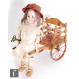 A late 19th Century French Roullet et Decamps girl pulling a cart automaton, circa 1890, the Limoges