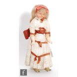 A late 19th Century German wax doll, circa 1880, possibly Cuno and Otto Dressel, with flirty blue
