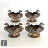 A set of four hallmarked silver pedestal open salts each modelled as two swans, total weight 4oz,