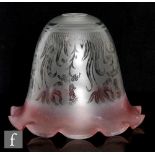 A Victorian glass lampshade, graduated ruby to clear, and acid etched with a floral pattern,
