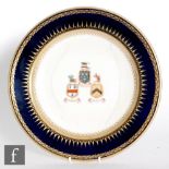 A 19th Century Kerr & Binns Worcester armourial plate decorated with three hand painted crests 'Un