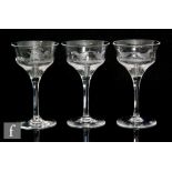 A set of three 1930s Stuart and Sons drinking glasses, each with an ogee bowl engraved with