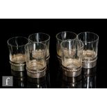 An early 20th Century set of six French silver and crystal shot glasses by Charles Barrier, circa