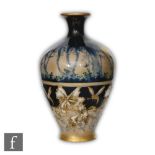 A late 19th to early 20th Century baluster vase decorated to the upper section with a hand painted