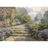 HERBERT H. COLLYER (1863-1947) - A garden in full bloom, watercolour, signed and dated 1934, framed,